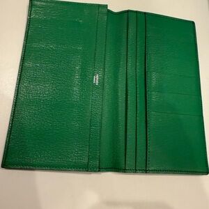 Black Leather Hermes Wallet with Green interior.